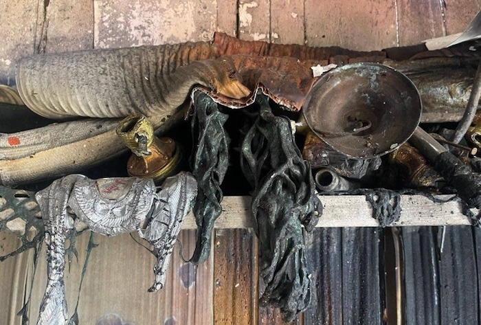 The melted candlesticks and other religious items in the church